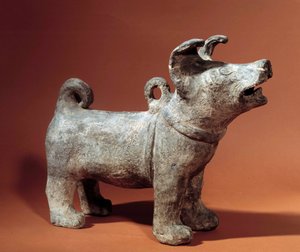 Chinese kunst: molos met harnas. Terracotta grafbeeldje uit de Han-periode (206 v.Chr.-220 n.Chr.). Musee Cernuschi, Parijs