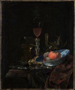 Wijnglas en een schaal fruit door Willem Kalf