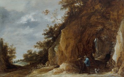 Boeren rusten op een pad in een rotsachtig bosrijk landschap door David Teniers the Younger