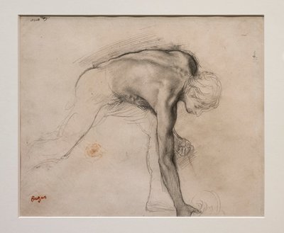 Naakte man die een voorwerp oppakt. Rond 1859-1861. Grafiet op velijnpapier. door Edgar Degas
