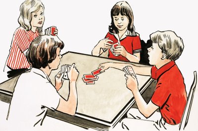 Vier kinderen aan het kaarten door English School
