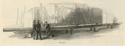 Twee mannen inspecteren een nieuwe boot in aanbouw door English School