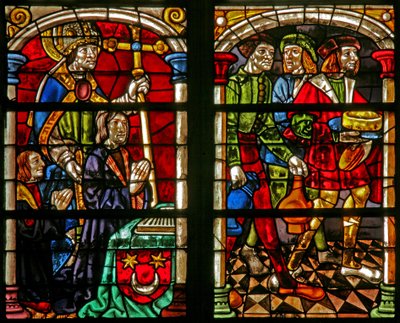Raam w232 met een scène uit het verhaal van de Verloren Zoon: drie figuren bij het feest van de terugkeer van de Verloren Zoon; links is de schenker en St. Willem door French School