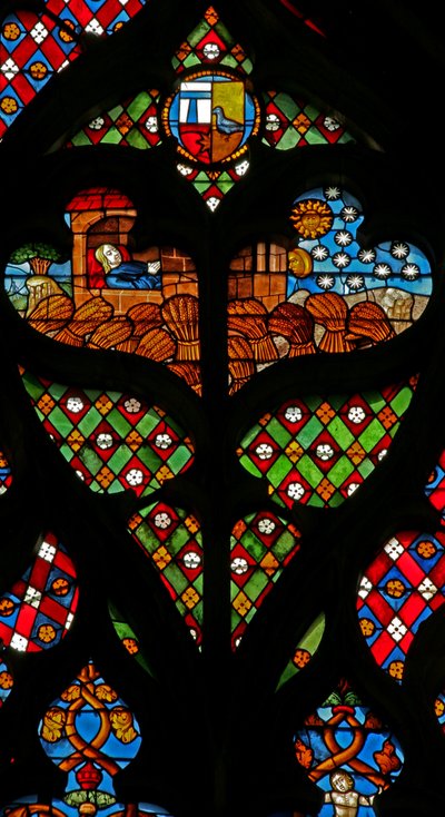 Een tracery licht met Jozef die droomt van de zon, maan en sterren, en dat de schoven van zijn broers voor hem buigen door French School