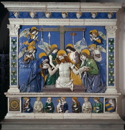 De Graflegging van Jezus in het Heilig Graf met de Maagd en Sint Johannes Evangelist. Weergave van symbolen van het Lijden: zwepen, doornenkroon en spons gedrenkt in azijn (posca). Hoog reliëf keramiek door Giovanni della Robbia (1469-1529) circa 14 door Giovanni della Robbia