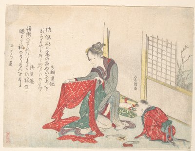 Vrouw die een doek opvouwt door Katsushika Hokusai