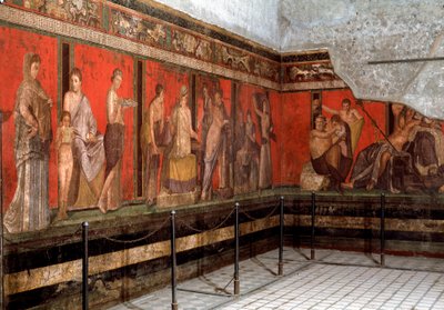 Inwijding in de cultus van Dionysus: een jongeman wordt ingewijd, leest het ritueel en een jongen brengt een offer. Fresco van de Villa des Mystères in Pompeii door Roman