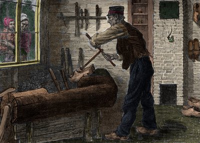 Een saboteur aan het werk in zijn werkplaats in België, in 