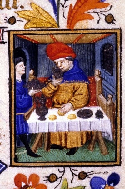 Voorstelling van de maand januari. Een dienaar zet eten op de tafel van zijn meester. Miniatuur van een 14e eeuws manuscript door Unknown artist