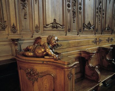 Barokke architectuur: houten koorbank die een engel voorstelt, attribuut van de evangelist Sint-Mattheus. Koor (18e eeuw) van de Sint-Stefanuskerk. Binnenaanzicht. Marmoutier, Bas-Rhin (67). door Unknown artist
