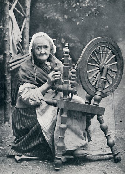 Een oude Ierse vrouw bij haar spinnewiel, 1912 door W. Lawrence