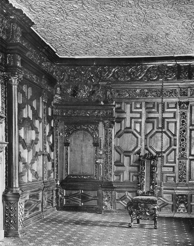 Een hoek in de eiken kamer door Charles Latham