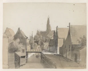 Gezicht op een grachtje in Haarlem, op de achtergrond de St. Bavo