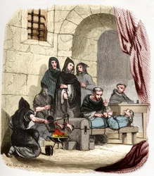 Inquisitie in Spanje in de 15e eeuw: Maria van Bourgondië (1457-1482), beschuldigd Joods te zijn, wordt gemarteld door de heilige Peter (Pedro) van Arbues (1441/1442-1485), Spaanse inquisiteur: hij verbrandt haar voeten. Illustratie in “Mysteriën van de