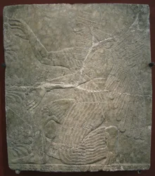 Gevleugelde godheid bij de heilige boom. Reliëf uit het paleis van Ashurnasirpal II in Kalhu, Nimrud