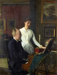 Acteur Peter Jerndorff en zijn vrouw Amalie aan de piano