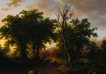 Reizigers op een pad bij zonsondergang