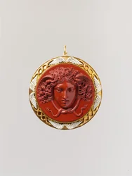 Hoofd van Medusa (Rode jaspis gemonteerd in goud met wit email)