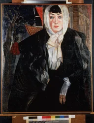 Vrouwenportret. Mooie vrouw met een melancholiek gezicht, op straat, haar hoofd bedekt met haar sjaal, gekleed in een grote zwarte jas, nonchalant leunend en een tere hand met een witte want tonend. Werk van Bo
