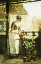 Vrouw die bloemen plant