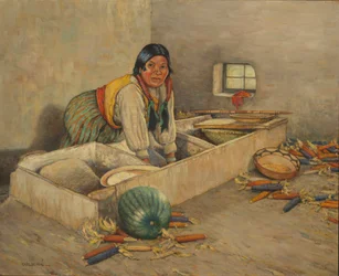 Hopi vrouw maalt maïs