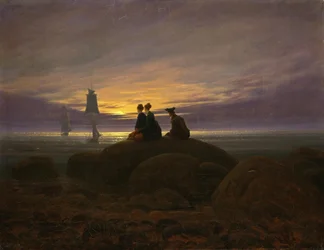 De maan komt op aan zee