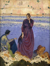 Twee vrouwen op rotsen bij de zee