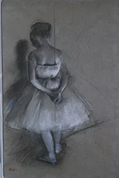 Danseres staand met handen gekruist achter haar rug, 1874