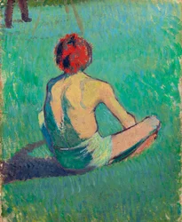 Jongen zittend in het gras