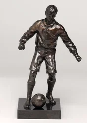 Voetballer, onderdeel van een klokset
