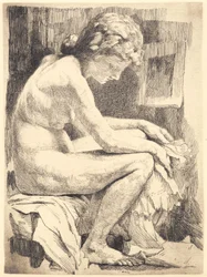 Jonge naakte vrouw, zittend