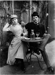 Koppel op het terras van een café en drinkend absint - foto, circa 1890