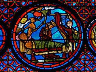 Detail uit een raam van de gelijkenis van Lazarus en de Rijke Man