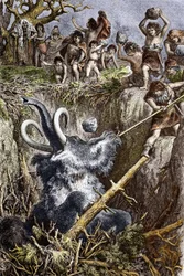 Paleolithicum: jachttafereel met mammoet, een stam prehistorische mannen werpt stenen naar een mammoet die in een kuil valt (paleolithische tijd: Europese holbewoners jagen op een mammoet die in een kuil viel), gravure uit de 19e eeuw, privécollectie