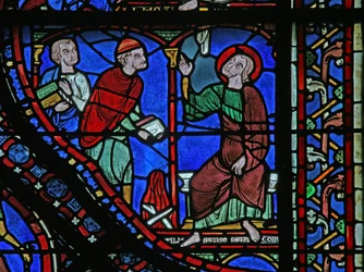 Het St. Jacobus raam: Almongenes (Hermogines) staat op het punt zijn boeken te verbranden