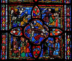 Raam met de tweede sectie van raam w7: in het midden is de kruisiging van St. Petrus; elders is St. Petrus voor Nero; St. Petrus gevangen; de duivel neemt een ziel