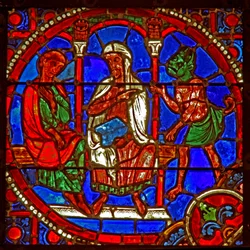 Ruit w1 met een scène uit het verhaal van Theophilus: hij wordt door een magiër aan Satan voorgesteld