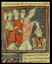 Fol. 142r: De kroning van Lodewijk I de Vrome (778-840), keizer van het Heilige Roomse Rijk, door paus Stefanus IV (paus 816-817) te Reims in 816, uit de Grandes Chroniques de France, 1375-79