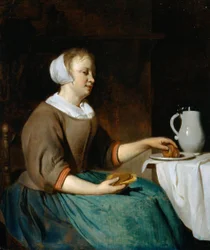 Jonge vrouw etend aan een tafel