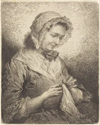 De vrouw van de kunstenaar aan het naaien