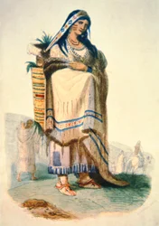Sioux moeder met baby in een wieg