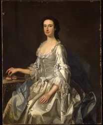 Mary, vrouw van Henry, 7e Lord Arundell van Wardour, in een grijze satijnen jurk, met rozen bij een tafel