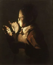 Jongen die bij een Lamp Blaast