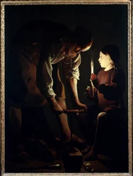Sint Jozef timmerman, Jezus kind houdt een kaars vast om zijn vader Jozef bij het werk te verlichten. Schilderij door Georges de La Tour (1593-1652) 1640 Parijs, Louvre Museum