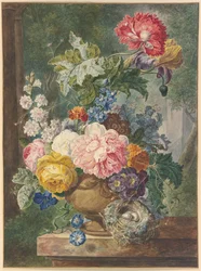 Boeket bloemen in een vaas met een vogelnest