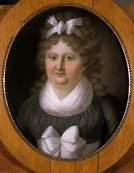 Portret van een vrouw met een lint in haar haar