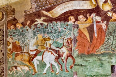 De dood staande op een sarcofaag waar de dode paus en de keizer liggen, detail uit de Triomf van de Dood en Dans van de Dood