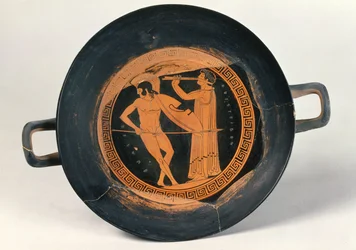 Griekse roodfigurenbeker, een krijger dansend de Pyrrhische dans, door Aristeides de Oudere