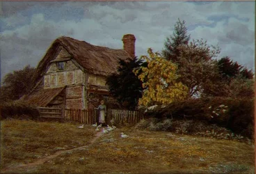 Laburnum Cottage: een vrouw die eenden voert