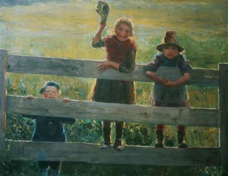 Drie kleine kinderen bij het hek